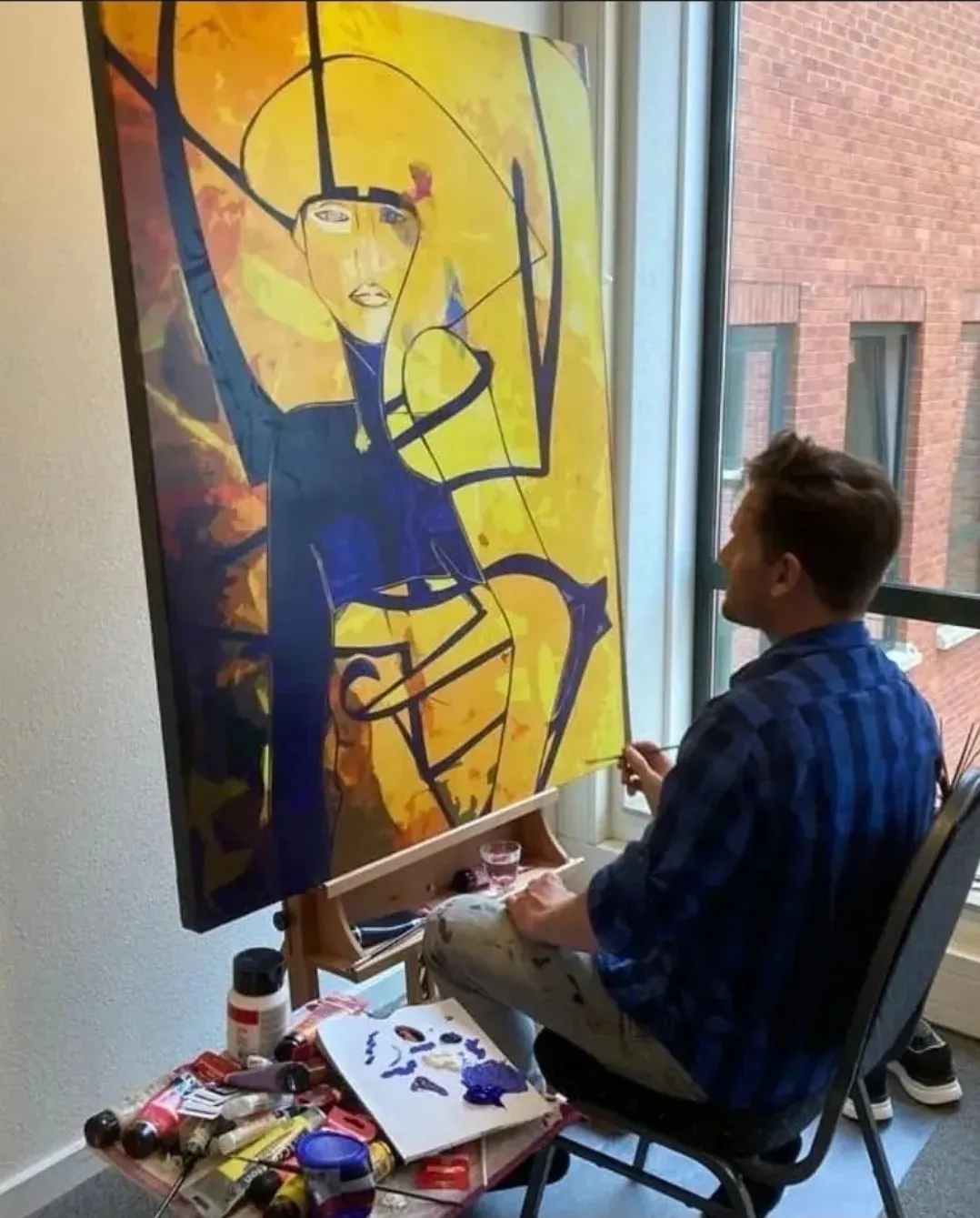 Dominic Brown at work at the easel