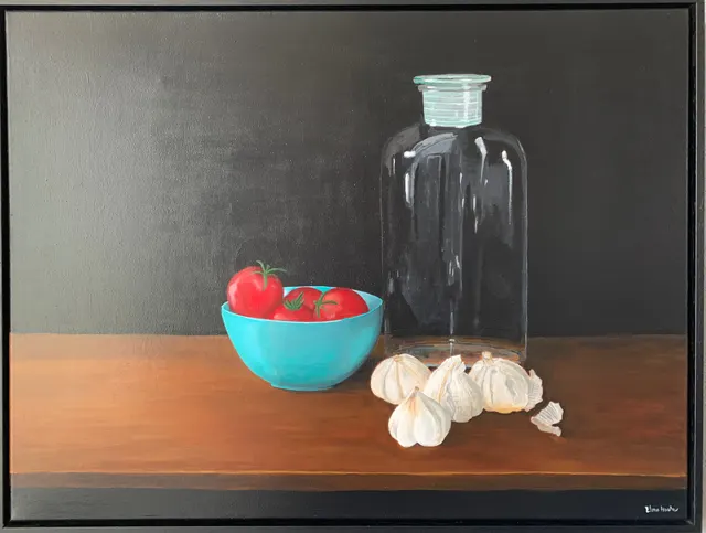 Glazen pot met tomaten en knoflook