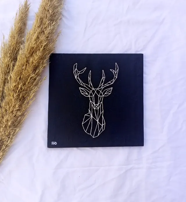 "Ethereal Elegance: Embroidered Gazelle on a Noir Canvas"